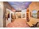 The hallway features themed rooms, brick floors and a sky painted ceiling at 4001 Pool Rd, Winston, GA 30187