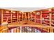 A unique library showcasing custom wood bookshelves and ornate iron railings at 4001 Pool Rd, Winston, GA 30187