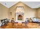 A grand stone fireplace is the focal point of the living room, which features hardwood floors and decorative seating at 4001 Pool Rd, Winston, GA 30187