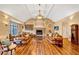 Bright, airy living room features a fireplace, large windows, hardwood floors, and comfortable seating, perfect for relaxation at 4001 Pool Rd, Winston, GA 30187