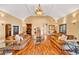 Spacious living room with vaulted ceilings, hardwood floors, and elegant furnishings creates an inviting space at 4001 Pool Rd, Winston, GA 30187