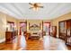 Spacious main bedroom boasts a four-poster bed, hardwood floors and a bay window at 4001 Pool Rd, Winston, GA 30187