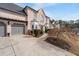 Exterior view of a house with a lush lawn, and a two car garage at 2971 Montview Sw Dr, Marietta, GA 30060