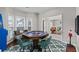 Game room features poker table, hardwood floor, an arcade game, and natural light at 2971 Montview Sw Dr, Marietta, GA 30060