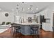 Spacious kitchen with a large granite island, stainless steel appliances, and stylish bar stools at 2971 Montview Sw Dr, Marietta, GA 30060