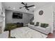 Comfortable living room with a large sectional sofa, stylish decor, and a modern ceiling fan at 2971 Montview Sw Dr, Marietta, GA 30060
