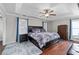 Serene primary bedroom featuring a tray ceiling, hardwood floors, and elegant furnishings at 2971 Montview Sw Dr, Marietta, GA 30060