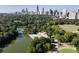 An aerial view of a city park with a lake and walking paths and city skyline in the background at 1101 Juniper Ne St # 721, Atlanta, GA 30309