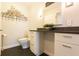Elegant bathroom with granite countertop, sleek fixtures, and ample cabinet space at 1101 Juniper Ne St # 721, Atlanta, GA 30309