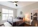 Inviting bedroom featuring hardwood floors, ceiling fan, and lots of natural light at 1101 Juniper Ne St # 721, Atlanta, GA 30309