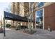 The building entrance features a covered walkway, landscaping, and large windows at 1101 Juniper Ne St # 721, Atlanta, GA 30309