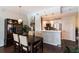 Stylish dining area with a view of the modern kitchen, creating a seamless and inviting space for meals and socializing at 1101 Juniper Ne St # 721, Atlanta, GA 30309