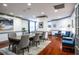 A modern dining room with large table, ample seating, and hardwood floors at 1101 Juniper Ne St # 721, Atlanta, GA 30309