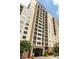 Condominium building with many balconies, located in an area with many trees and well-maintained landscaping at 1101 Juniper Ne St # 721, Atlanta, GA 30309
