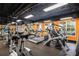 Fitness center showcasing treadmills, elliptical machines, and vibrant orange walls at 1101 Juniper Ne St # 721, Atlanta, GA 30309