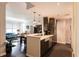 Open-concept kitchen with stainless steel appliances and breakfast bar, seamlessly connecting to the living area at 1101 Juniper Ne St # 721, Atlanta, GA 30309