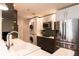 Modern kitchen featuring stainless steel appliances, white countertops, and a convenient in-unit washer/dryer at 1101 Juniper Ne St # 721, Atlanta, GA 30309