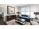 Cozy living room featuring plush seating, stylish decor, and ample natural light, creating a welcoming ambiance at 1101 Juniper Ne St # 721, Atlanta, GA 30309