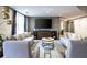 Well-designed lounge with contemporary furniture, large screen TV and elegant decor at 1101 Juniper Ne St # 721, Atlanta, GA 30309
