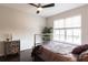This is a comfortable main bedroom with modern furnishings, a ceiling fan, and a stylish bed at 1101 Juniper Ne St # 721, Atlanta, GA 30309