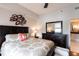 This main bedroom offers ample space, a ceiling fan, and a lovely view into the en suite bathroom at 1101 Juniper Ne St # 721, Atlanta, GA 30309