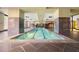 Indoor swimming pool with tiled deck and lane markers for fitness and recreation at 1101 Juniper Ne St # 721, Atlanta, GA 30309