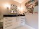 Stylish powder room with modern vanity, elegant mirror, decorative lighting, and contemporary artwork at 1101 Juniper Ne St # 721, Atlanta, GA 30309