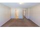 Comfortable bedroom featuring neutral walls and carpets, with ensuite bathroom access at 1830 Bayrose Cir # 30B, East Point, GA 30344
