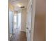 Hallway with carpet and neutral colored walls with white doors to bedrooms at 1830 Bayrose Cir # 30B, East Point, GA 30344