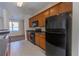 Well-equipped kitchen showcasing wooden cabinets and modern appliances at 1830 Bayrose Cir # 30B, East Point, GA 30344