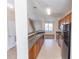 Spacious kitchen featuring stainless steel appliances and wooden cabinets at 1830 Bayrose Cir # 30B, East Point, GA 30344