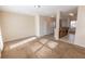 Bright living room with neutral walls and carpet is adjacent to the kitchen at 1830 Bayrose Cir # 30B, East Point, GA 30344