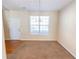 Bright living room with large window, chandelier, and entryway access at 1830 Bayrose Cir # 30B, East Point, GA 30344