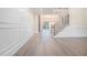 Elegant foyer boasting hardwood floors, wainscoting, and a modern staircase with metal railing at 3825 Hall Rd, Dacula, GA 30019