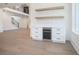 Open-concept living area features custom cabinets and a beverage center with wood accents at 3825 Hall Rd, Dacula, GA 30019