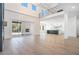 Open-concept living room with fireplace, sliding glass doors, and gourmet kitchen with island at 3825 Hall Rd, Dacula, GA 30019
