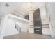 Bright living room showcasing high ceilings, fireplace, hardwood floors and stylish light fixtures at 3825 Hall Rd, Dacula, GA 30019