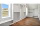 Large walk-in closet with window seat, custom shelving and rich hardwood floors at 3825 Hall Rd, Dacula, GA 30019