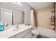 This bathroom features a white vanity, bathtub, and shower, providing a clean and functional space at 829 Waterford Estates Mnr, Canton, GA 30115