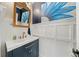 Stylish bathroom with vanity, mirror, and decorative accents at 829 Waterford Estates Mnr, Canton, GA 30115