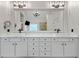 Bathroom featuring a large double vanity with quartz countertops, matte black fixtures, and a modern chandelier at 829 Waterford Estates Mnr, Canton, GA 30115