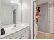 Bathroom featuring a vanity with lots of counter space, a mirror, and storage at 829 Waterford Estates Mnr, Canton, GA 30115