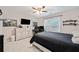 Bedroom featuring a ceiling fan, wall décor, neutral-toned walls, and a comfortable bed at 829 Waterford Estates Mnr, Canton, GA 30115