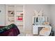 Bedroom featuring a built-in bookcase, a vanity with a lighted mirror, and a fuzzy chair at 829 Waterford Estates Mnr, Canton, GA 30115