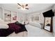 Bright bedroom with plush carpet, ceiling fan, built in bookcases, and lots of natural light at 829 Waterford Estates Mnr, Canton, GA 30115
