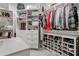 Organized walk-in closet with shelving, shoe racks, drawers, and clothing racks at 829 Waterford Estates Mnr, Canton, GA 30115