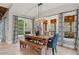 Open dining area with wood table, pendant lighting, and natural light at 829 Waterford Estates Mnr, Canton, GA 30115