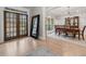 Spacious foyer adjacent to a formal dining area, featuring elegant millwork and a view of the well-manicured front yard at 829 Waterford Estates Mnr, Canton, GA 30115