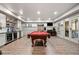 Large game room with a pool table, bar, and access to an outdoor patio at 829 Waterford Estates Mnr, Canton, GA 30115