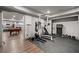 Home gym featuring weightlifting equipment and a rubber floor, connected to the game room at 829 Waterford Estates Mnr, Canton, GA 30115